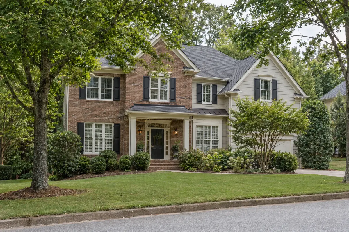 Well-maintained home exterior with strong curb appeal and mature trees